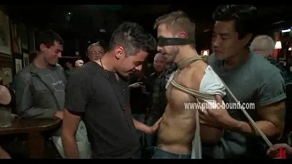 XXX Tied up and blindfolded gay slave gets to suck strangers cock while in a bar วิดีโอยอดนิยม