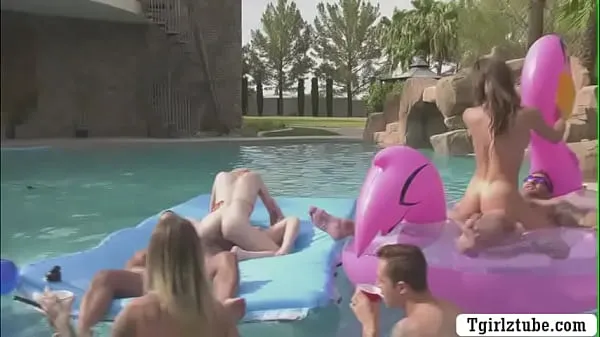 XXX Busty shemales are in the swimming pool with many guys that,they decide to do orgy and they start kissing each is,they suck their big cocks passionately and they let them bareback their wet ass too top video's